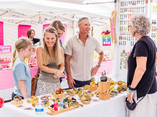 a family shopping for jewellery at Eumundi Markets