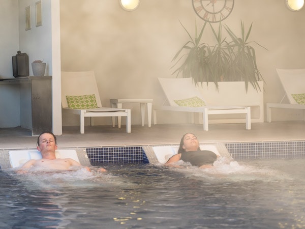 Couple enjoying a relaxing visit to the Moree Artesian Aquatic Centre.