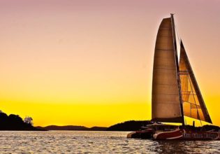 Sailing into the Whitsundays sunset, drink and canape in hand, of course.