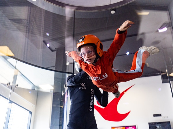 a kid trying out indoor skydiving at iFly Gold Coast