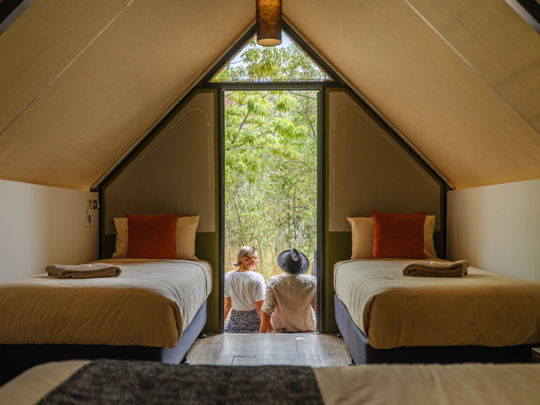 a couple sitting outside a luxury tent at Emma Gorge El Questro