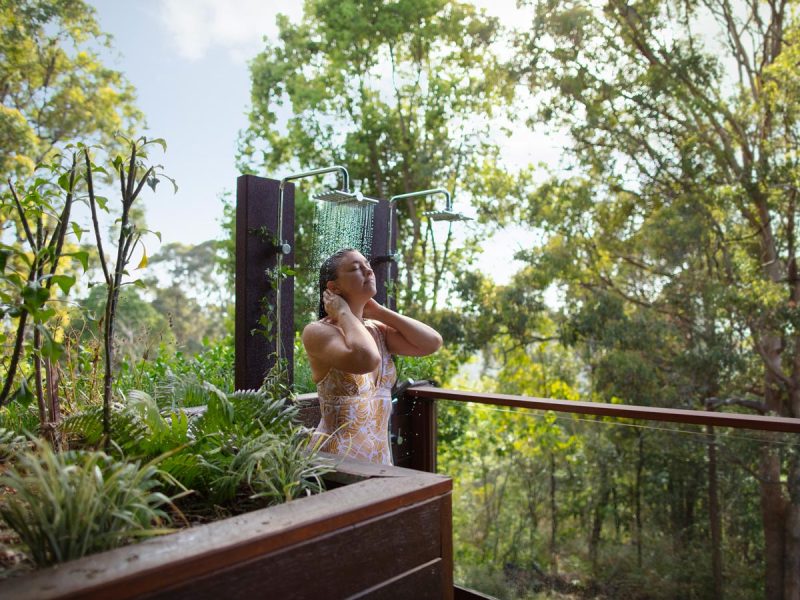 Gwinganna Lifestyle Retreat woman in outdoor shower