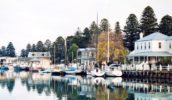 Boats hug Port Fairy's pretty wharf