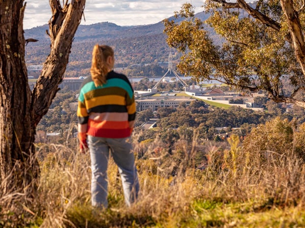 a woman standing on top of Red Hill Lookout