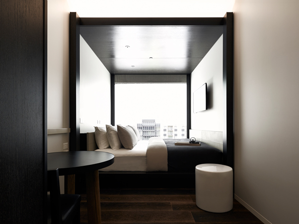 a king-sized bed in Little National Hotel, Canberra