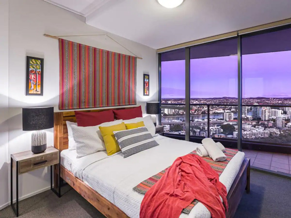 bedroom with city views at African Escape, South Bank