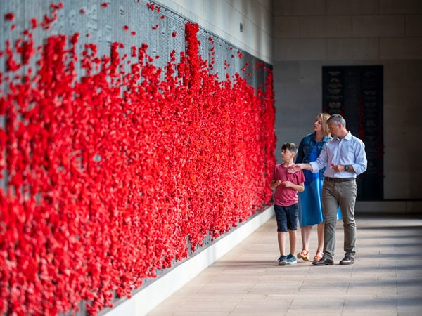 a family exploring inside Australian War Memorial