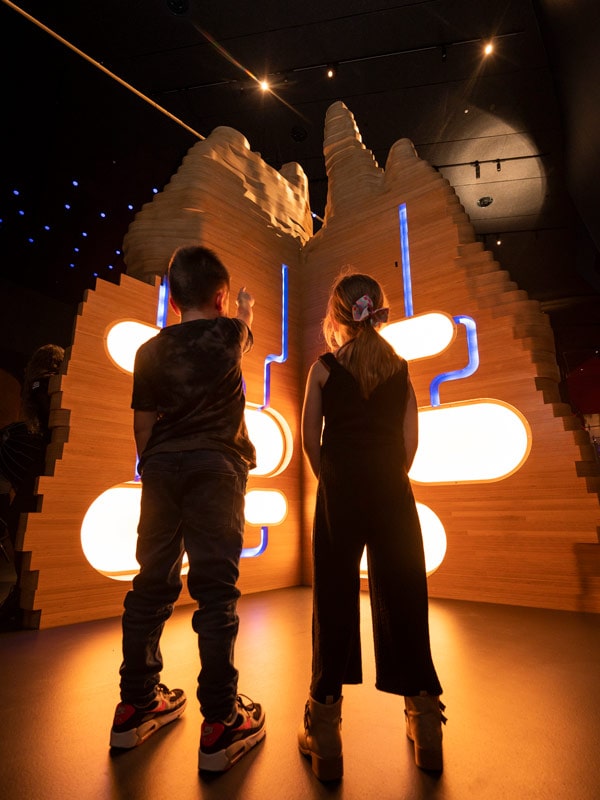 kids gazing at a spectacular installation inside National Museum of Australia