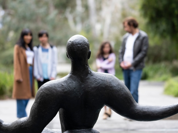a statue facing backwards at National Gallery of Australia