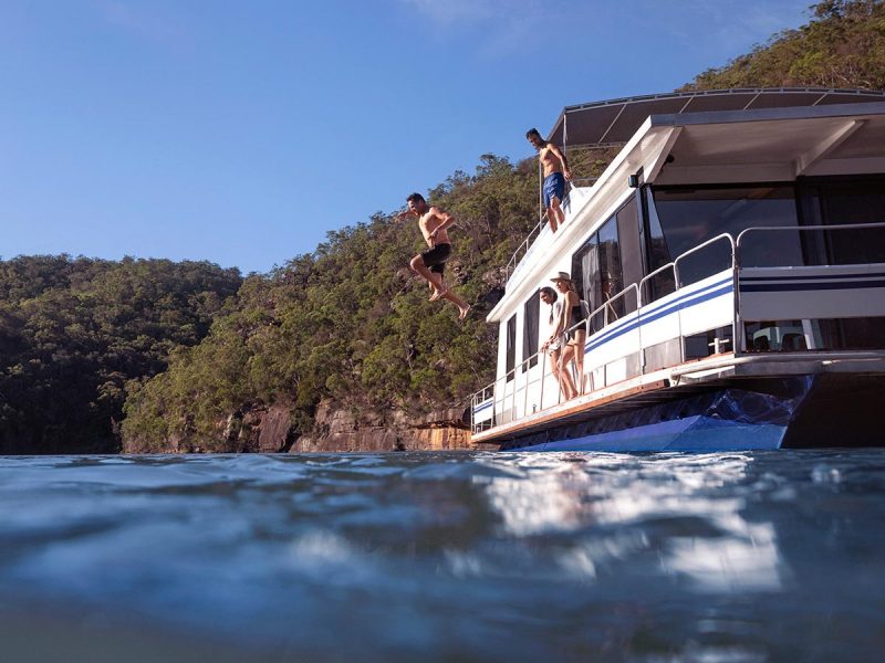 Couples enjoying a day out on the Hawkesbury River on their houseboat.