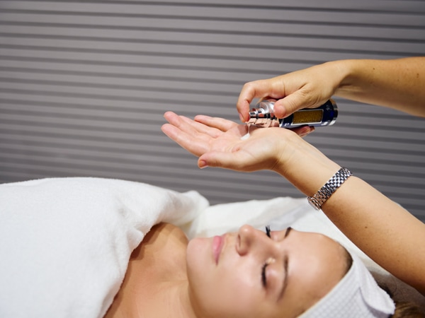 a woman having a facial massage at La Prairie Art of Beauty Lounge