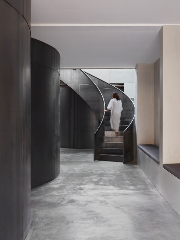 a woman going up the stairs at Venustus, Paddington