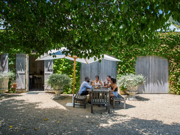 friends drinking on the al fresco grounds of KrinklewoodBiodynamic Winery, Broke in the Hunter Valley.