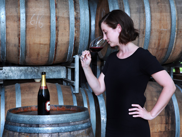 a woman sipping red wine at Stonehurst Cedar Creek, Hunter Valley