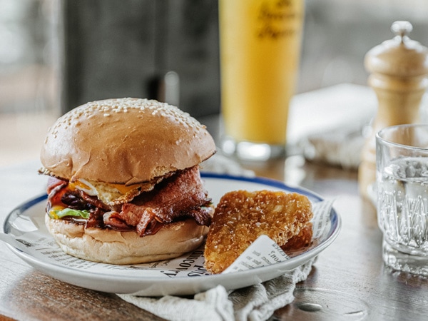 a burger on a plate at Edgar's Inn