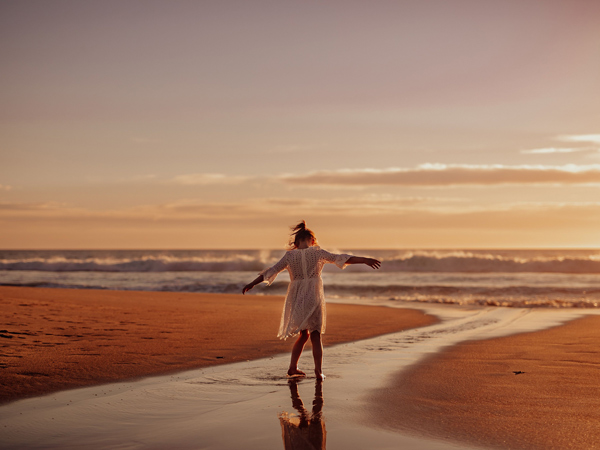 a woman admiring the views at Maslin Beach, South Australia