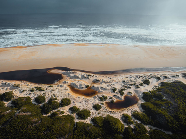 an aerial view of the shore at Ocean Beach, Tas