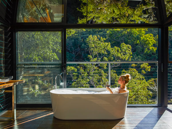 a woman dipping in the tub at Spicers Sangoma, Bowen Mountain