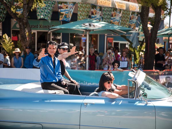 Elvis impersonator in a car