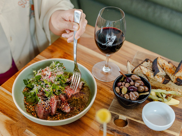 a plate of food and wine at Lums Wine Bar, Perth