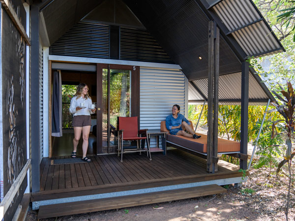two women having coffee on the front porch at Anbinik Kakadu Resort