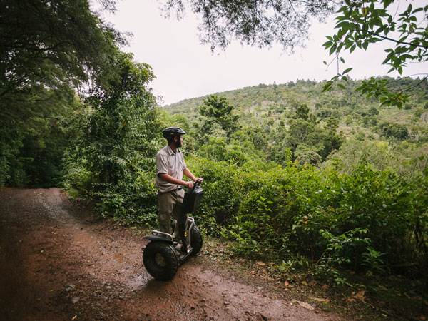 a guy riding an electric scooter at Lamington National Park