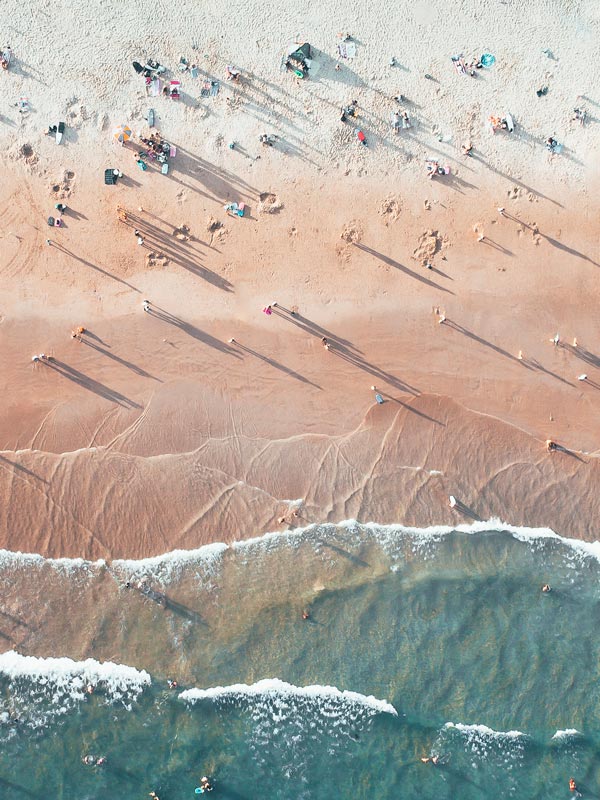 an aerial view of beachgoers on Freshwater Beach, Freshwater