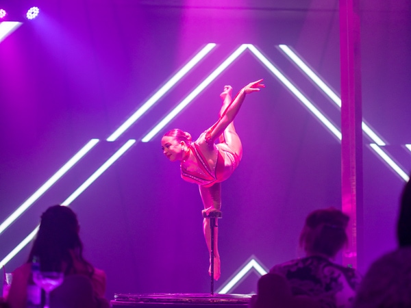 a gymnast performing on stage at Pink Flamingo