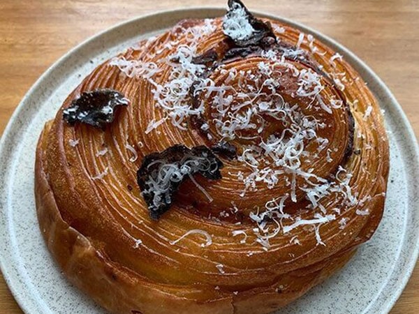 a close-up photo of bread on a plate at Black Cockatoo Bakery