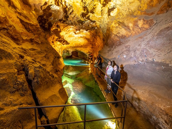 a group of tourists exploring Jenolan Caves