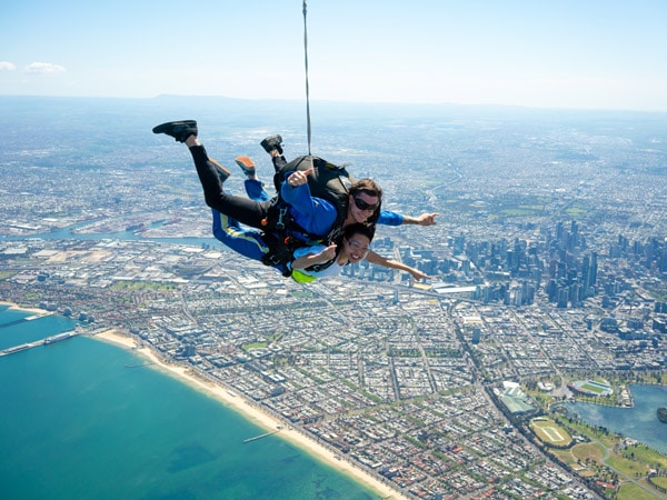 two skydivers on top of Port Phillip Bay
