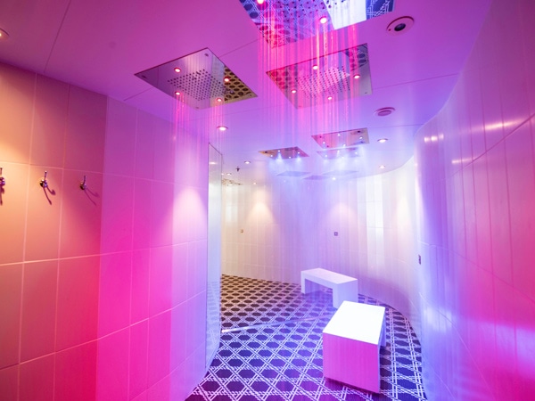 a pink-coloured rainfall water therapy room in the spa of Celebrity Edge cruise ship, Australia