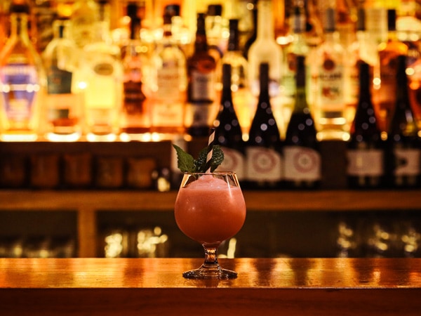 a cocktail drink on the table at The Swinging Cat