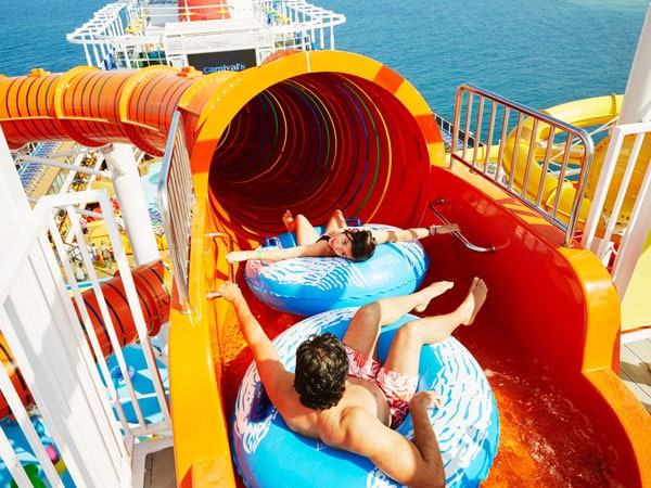 two people gliding through the huge slide at Carnival Splendor cruise ship, Australia