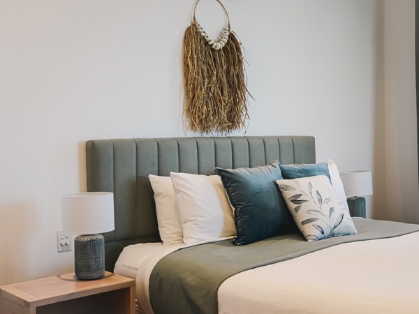 a close-up shot of the bed with pillows at Beach Suites Byron Bay Penthouse