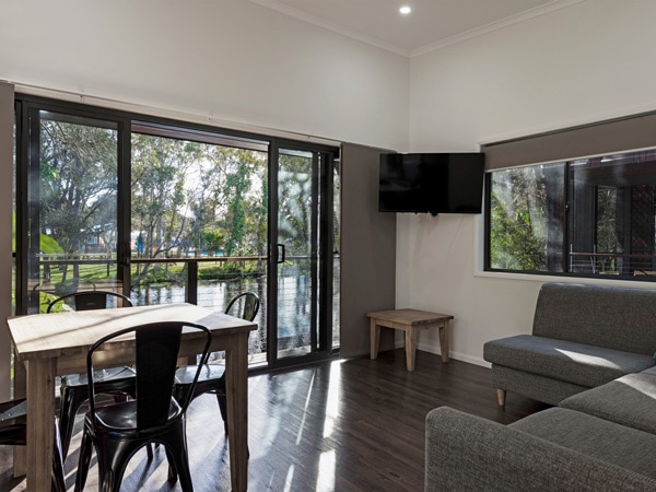 a superior room beside a lake at Discovery Parks Byron Bay