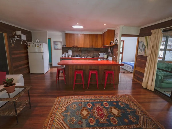 kitchen and dining area at Magical Treetops House on Byron Nature Reserve