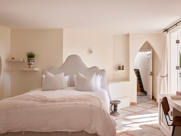 a white-painted bedroom at Raes on Wategos, Byron Bay