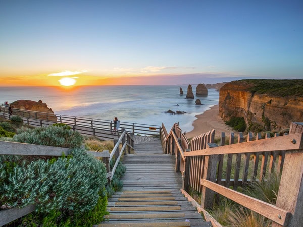 a staircase leading to the lookout of the Twelve Apostles at sunset