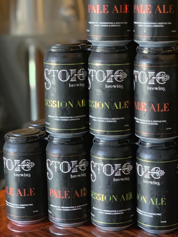 Cans of Stoic Brewing Company beer