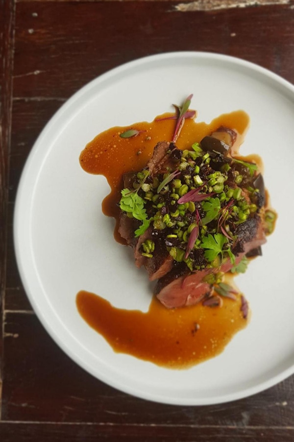Plate of steak and sauce at Silica restaurant