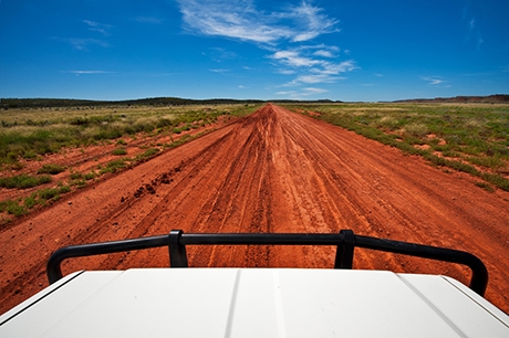 Red desert track in Central Australia.