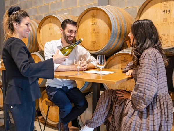 a couple enjoying a wine-tasting session at Jackalope