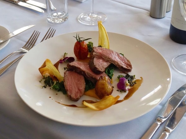 a plate of meat dish on the table at Marco's On Albert