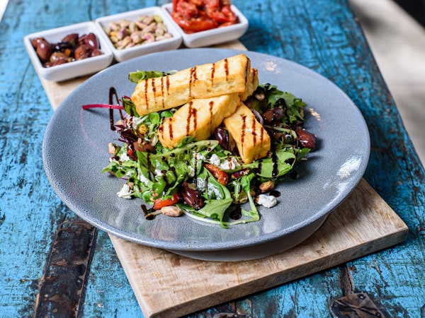 a plate of vegetable salad at Uneke Lounge