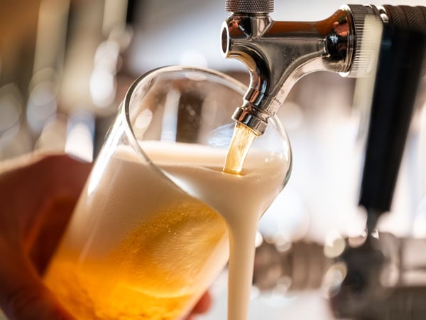 pouring tap beer into a glass at Capital Brewing Co., Fyshwick