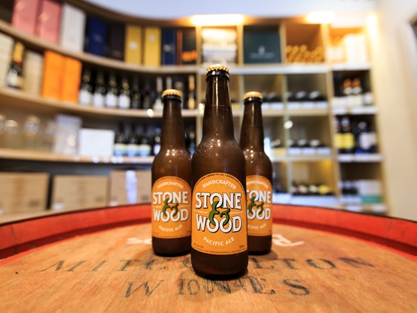 three bottles of local beers on the table at Stone & Wood, Byron Bay