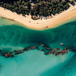 an aerial view of The Wrecks Campground, Moreton Island