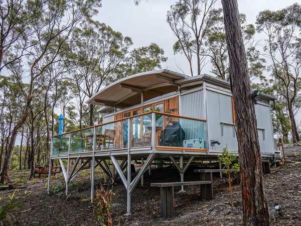 a forest lodge perched on wood