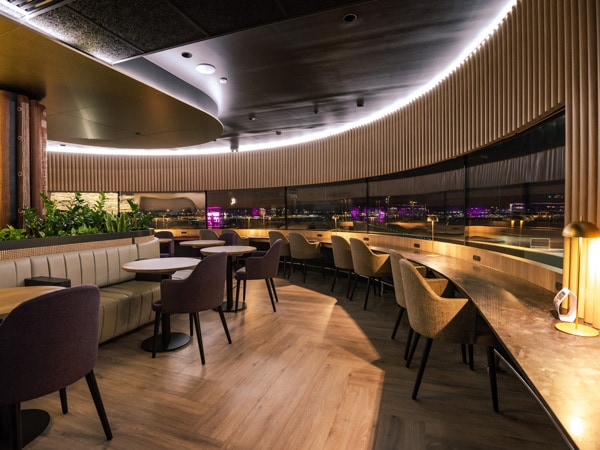the interior with chairs at the International Aspire Lounge